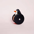 Bajo Stehaufmännchen Pinguin aus Holz auf Rädern
