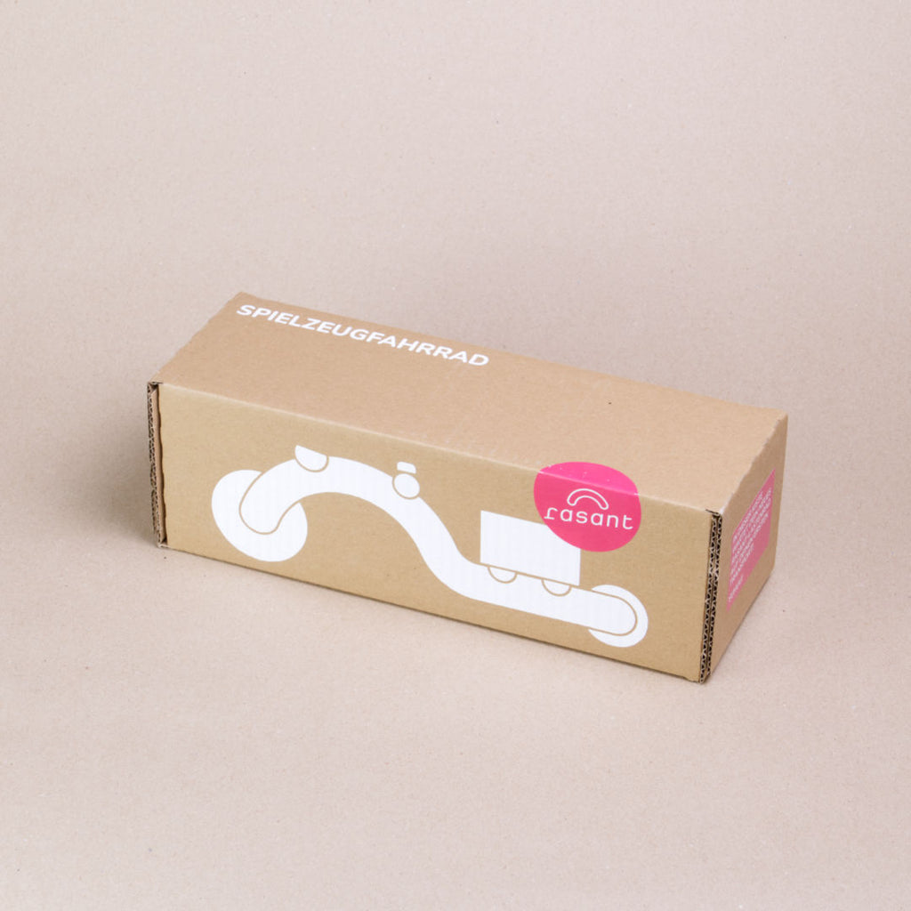 Verpackung des Lastenfahrrads von rasant in magnoliefarben.
