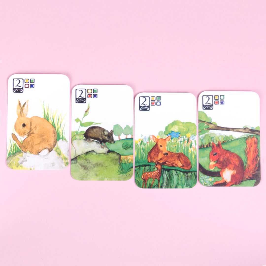 4 Karten nebeneinander liegend aus dem Tierquartett.