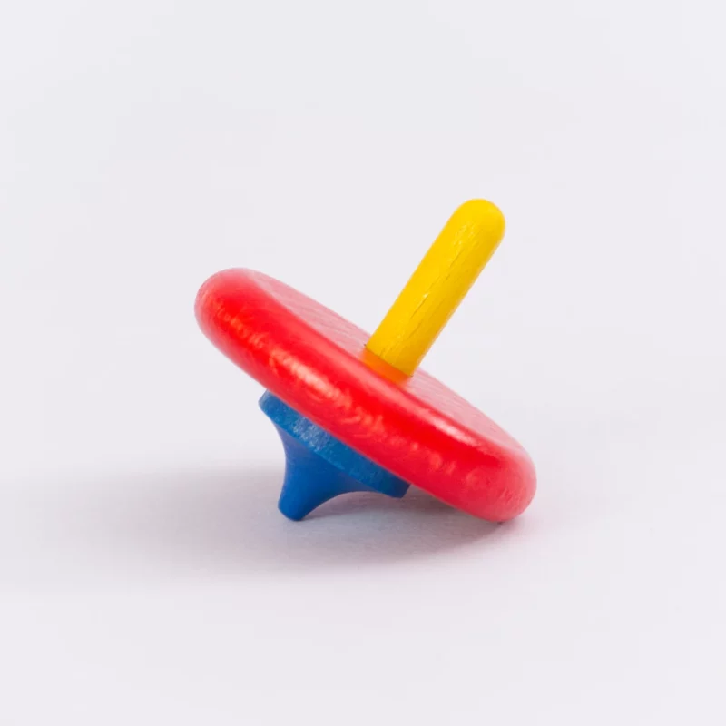 Kreisel von Beck in blau, rot und gelb. Seitenansicht